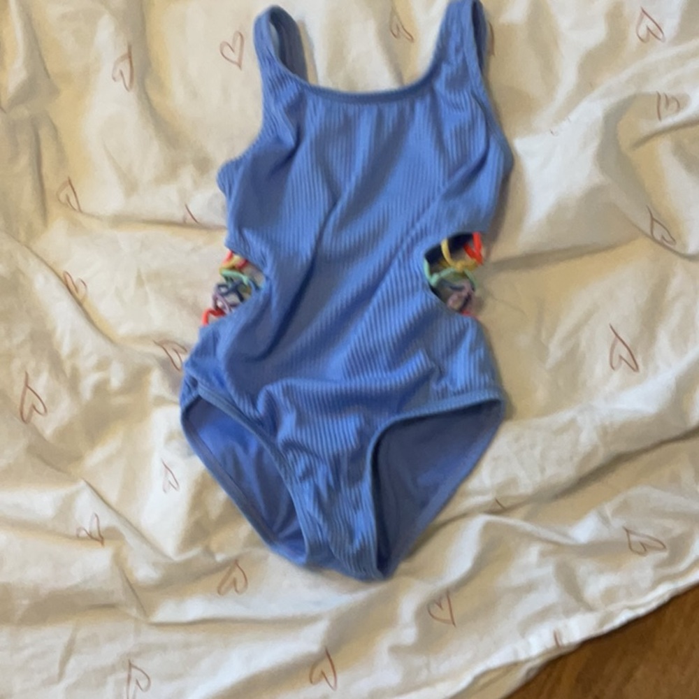 Girls blue one piece, swim suit with rainbow tie sides